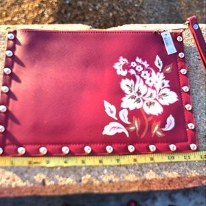 White house black market large maroon with white floral design wristlet